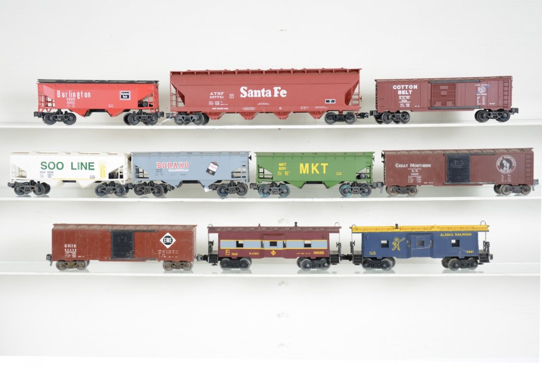 10 Modern Freight Cars: Includes a Weaver scale hopper; 5 assorted K-Line classic Freight cars with metal sprung trucks; 2 KMT boxcars; 2 Lionel cabooses. All have some shelf dust, otherwise C8