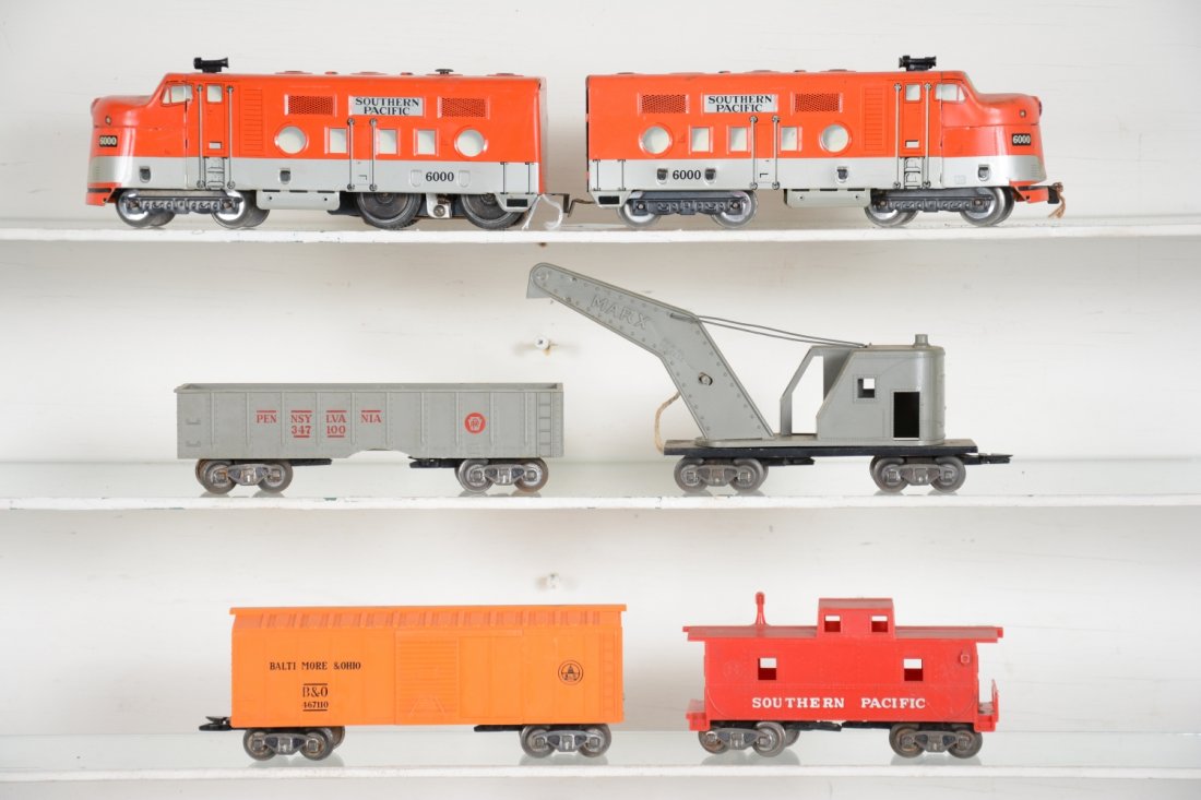 6Pc Marx SP Diesel Freight Set: Includes a 6000 SP F7 AA diesels, missing 1 ornamental horn; PRR gondola, chipped on side; B&O boxcar; NYC crane, missing hook and top wire support; SP caboose. All are clean with scale trucks. Rest s
