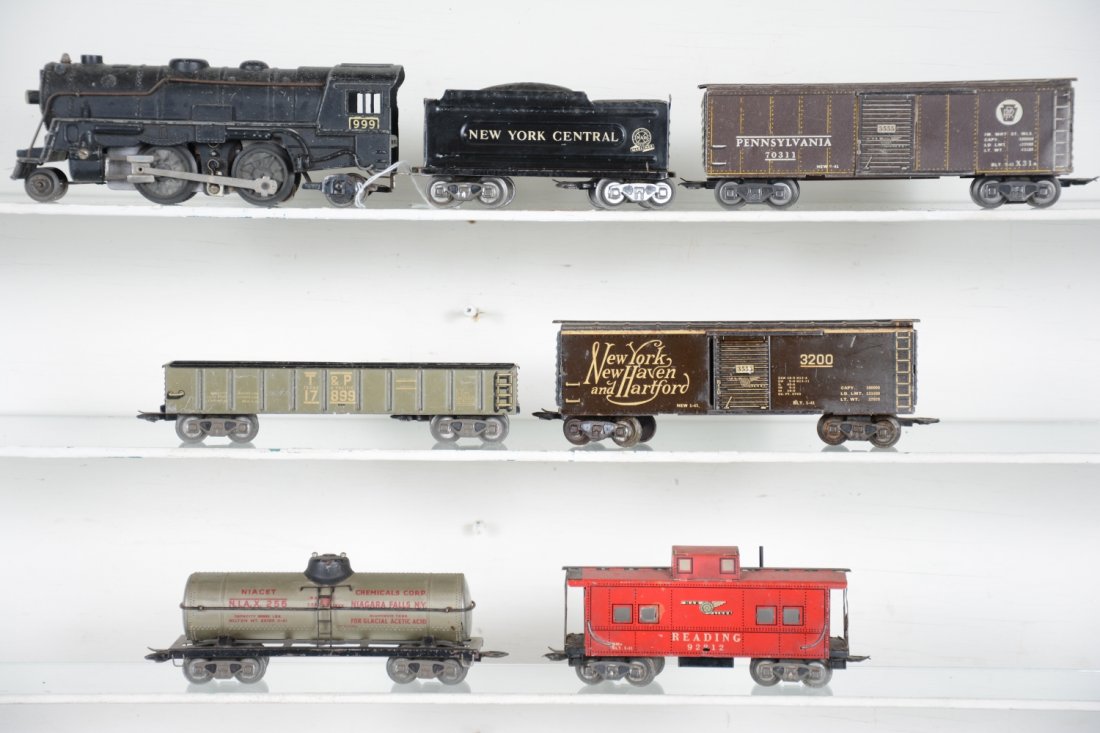 Scarce Marx Pre War 3/16 Set: Includes a 999 steam loco with rare intact open cowcatcher; NYC wedge tender; NYNH&H boxcar; NIAX tank; PRR boxcar; T&P gondola; Reading caboose. All show moderate playwear, C5-6
