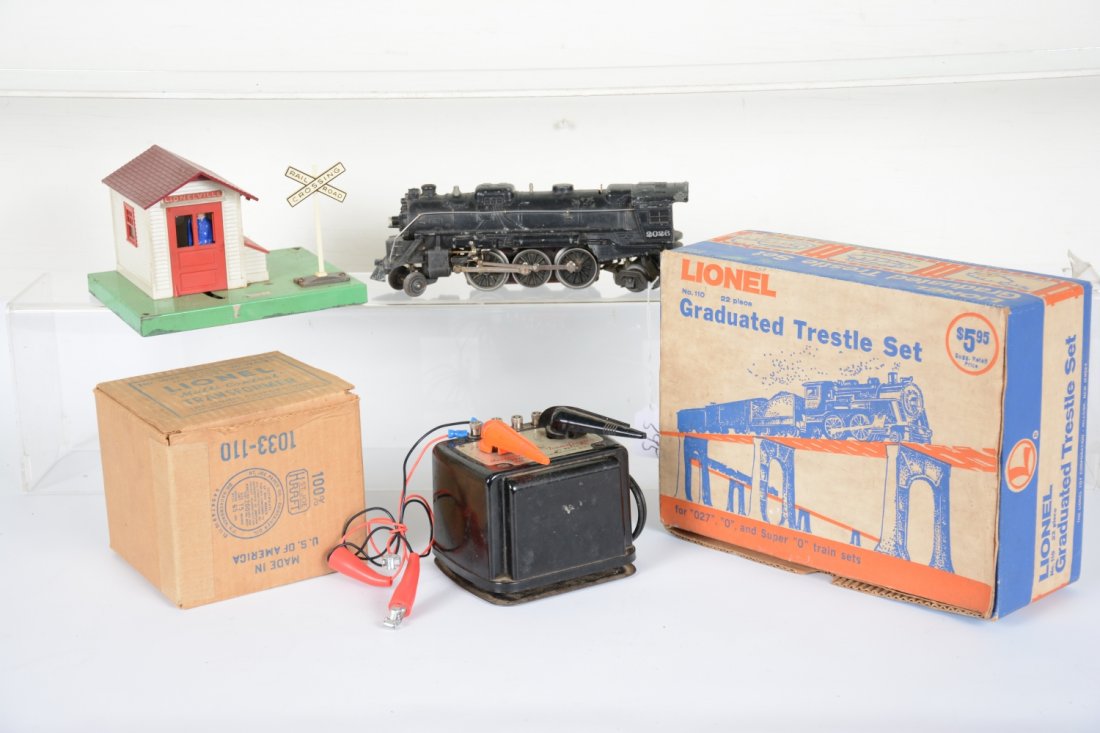 4Pc Lionel Lot: Includes a scarce Hillside 110 trestle set, no packet, C7; boxed 1033 90 watt transformer, C7; 145 gateman, C6; 2026 loco, slight bend to cab corner, C5