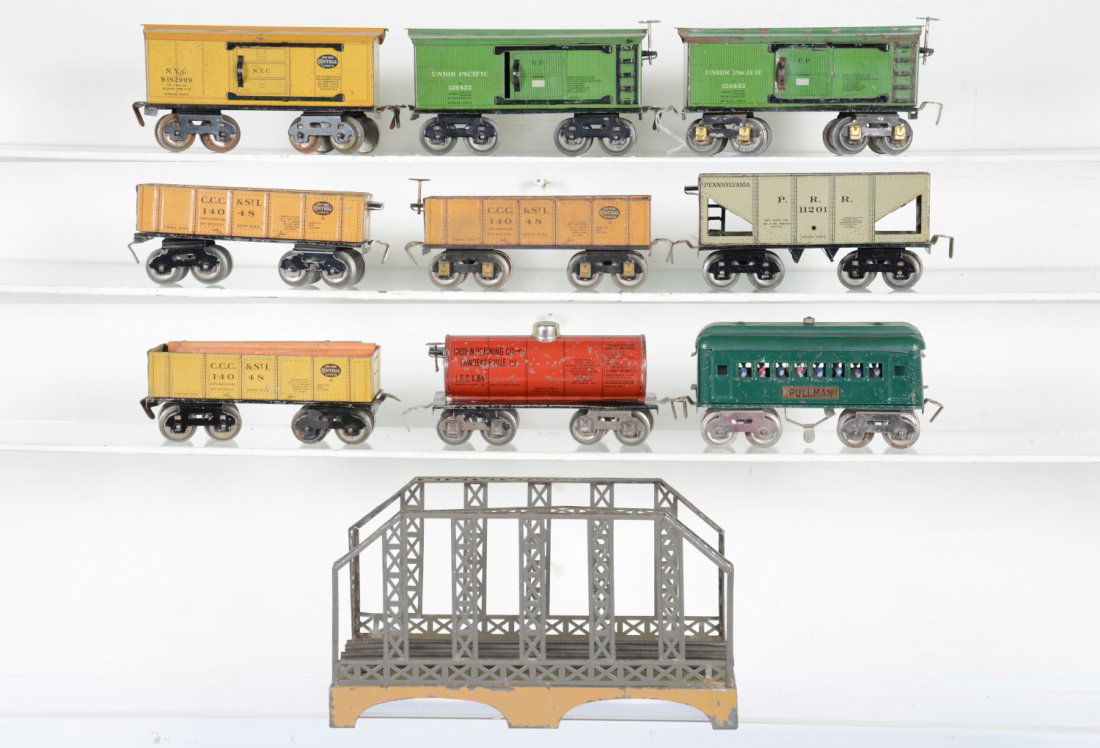 10Pc Dorfan Lot: Includes a center section bright; restored Pullman; 2 UP boxcars, 1 missing brake wheel; 3 NYC gondolas, 2 missing brake wheels; NYC boxcar, missing brake wheel; Indian tank car, C4, otherwise all sho