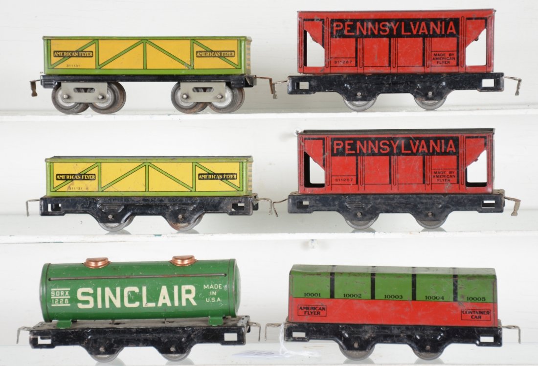 6 American Flyer Lithographed Freight Cars: Includes a 1228 Sinclair tank; 2 #1267 hoppers; 2 #1131 sand cars; container gondola. All are clean & shiny, showing moderate playwear, C6