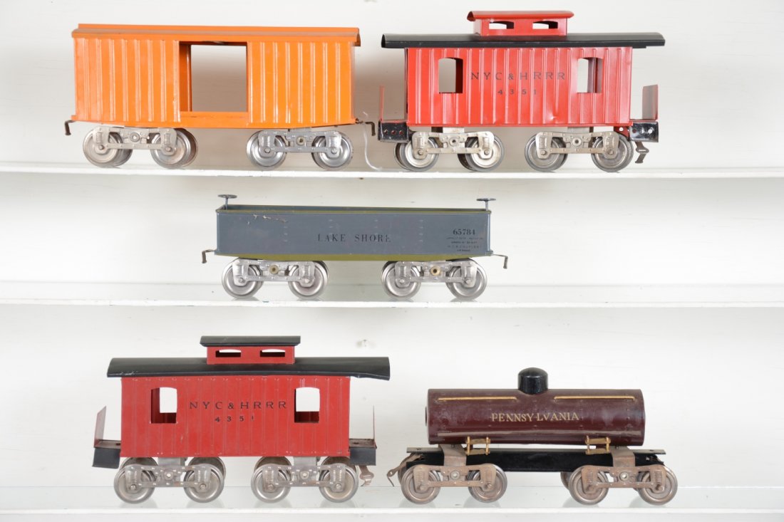 5 Restored Early Lionel Freight Cars: Standard gauge. Includes a 15 PRR tank car; 112 Lake shore gondola; 2 #17 cabooses; 14 boxcar, no lettering. All need a cleaning, but otherwise nicely done.