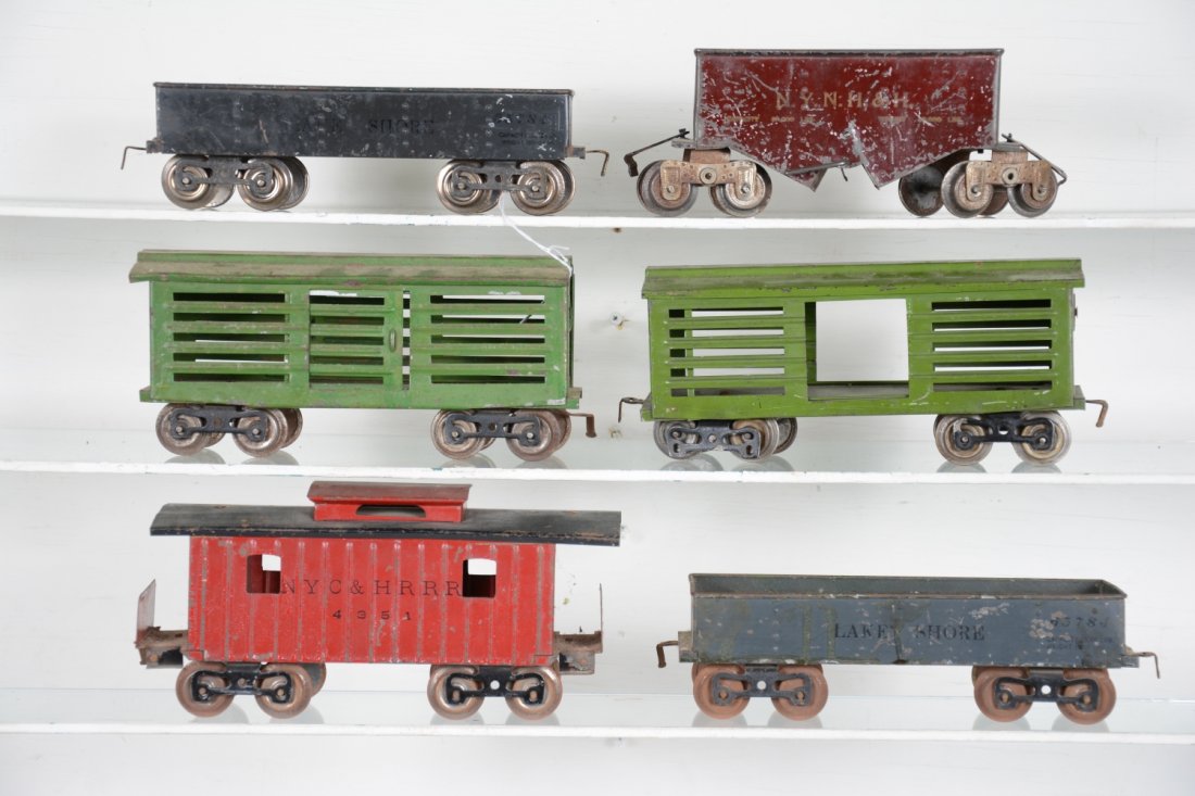 6 Early Lionel Freight Cars: Standard Gauge. Includes 2 #112 Lake shore gondolas; 2 #113 stock cars, 1 repainted; MFG 116 hopper, C3; 117 caboose. Rest show moderate playwear, C5