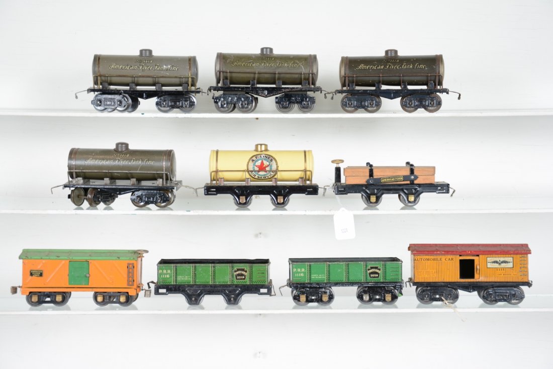 10 American Flyer Freight Cars: Includes 4 #1118 tank cars; 2 #1116 PRR gondolas; 1115 boxcar, roof repainted; 229 boxcar; 231 tank car restored; 241 lumber car, restored. Rest show light to moderate playwear, C6-7