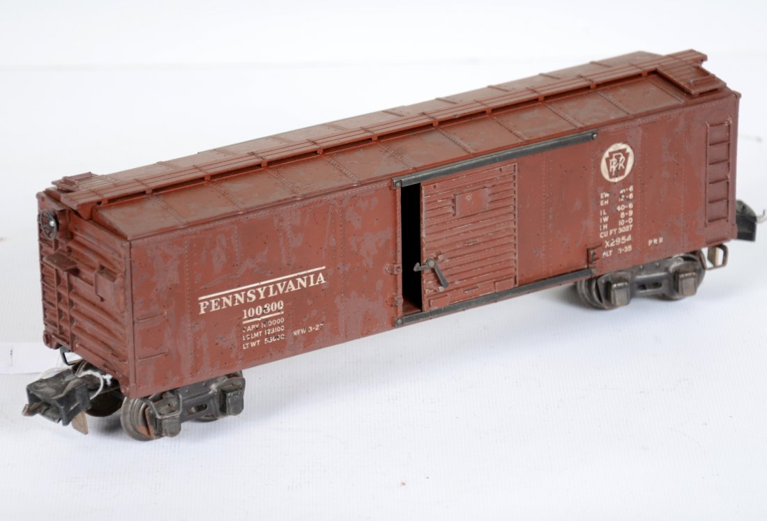 Lionel 2954 Semi-Scale Boxcar: Clean and intact car equipped with high box couplers, There are many small touch-up spots throughout, C5. Appears nicer.