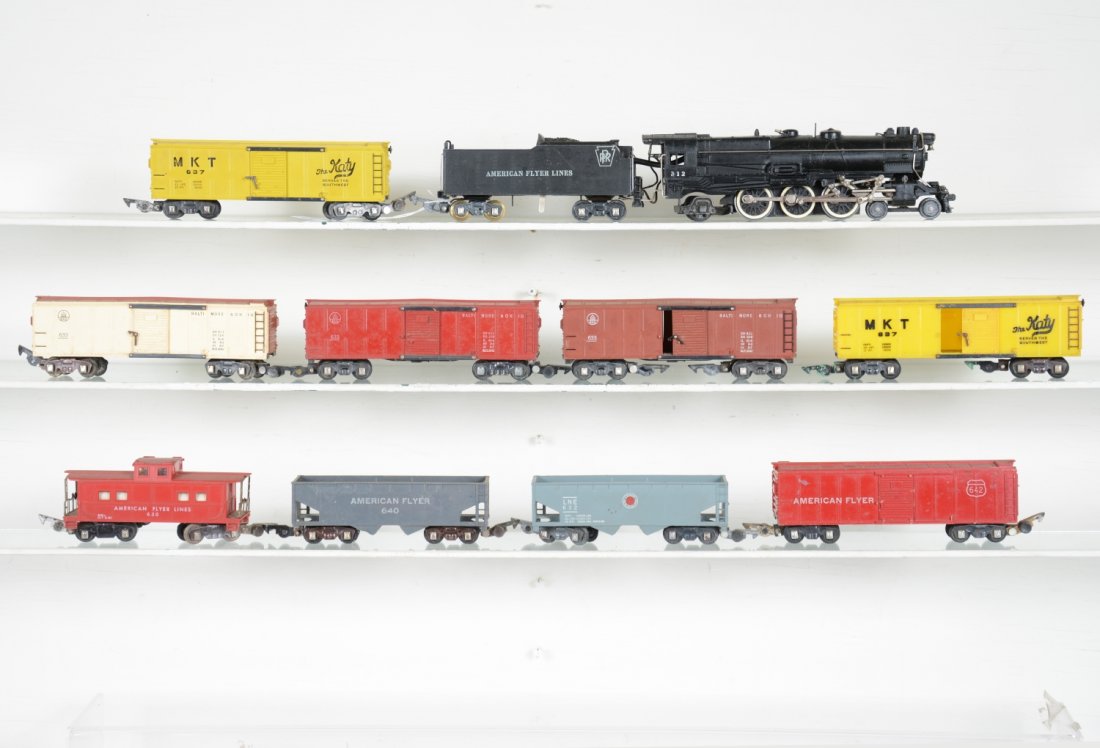 10Pc American Flyer 312 Steam Freight Set: S Gauge. Includes a 312 PRR K4 steam loco, smoke in tender; 3 different 633 B&O boxcars; 2 different 637 boxcars; 640 hopper; 642 boxcar; 632 LNE hopper; 630 caboose. All show light to moderate playwe