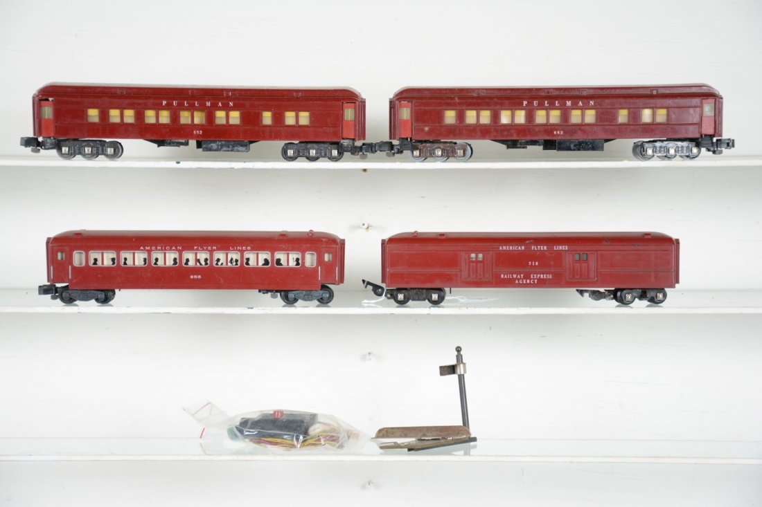 American Flyer Passenger Cars: S Gauge. Includes a 718 operating mail car with 2 bags, instructions, activator & controller; 955 Coach with silhouettes; 2 #652 Heavyweight Pullmans with knuckle conversions. They show light to moder