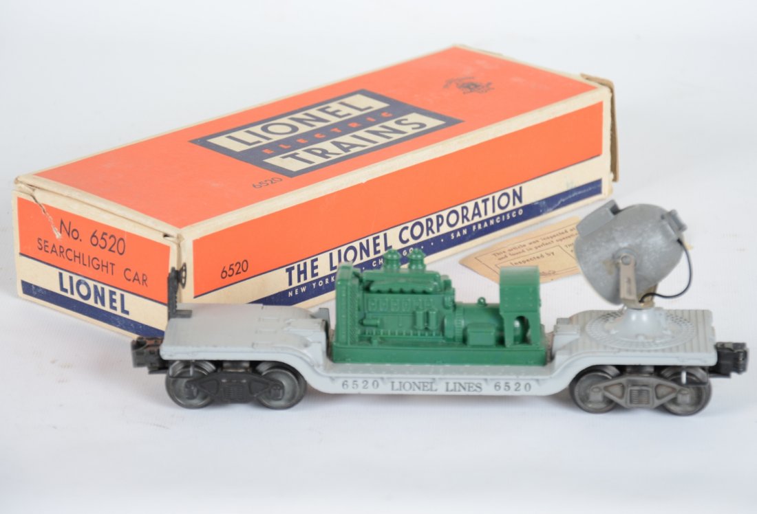 Nice & Scarce Boxed Lionel 6520 Green Searchlight Car: High grade example of this early issue with unpainted green generator with crackle light housing. It has a C7 box with inspection label, C8 Nice.