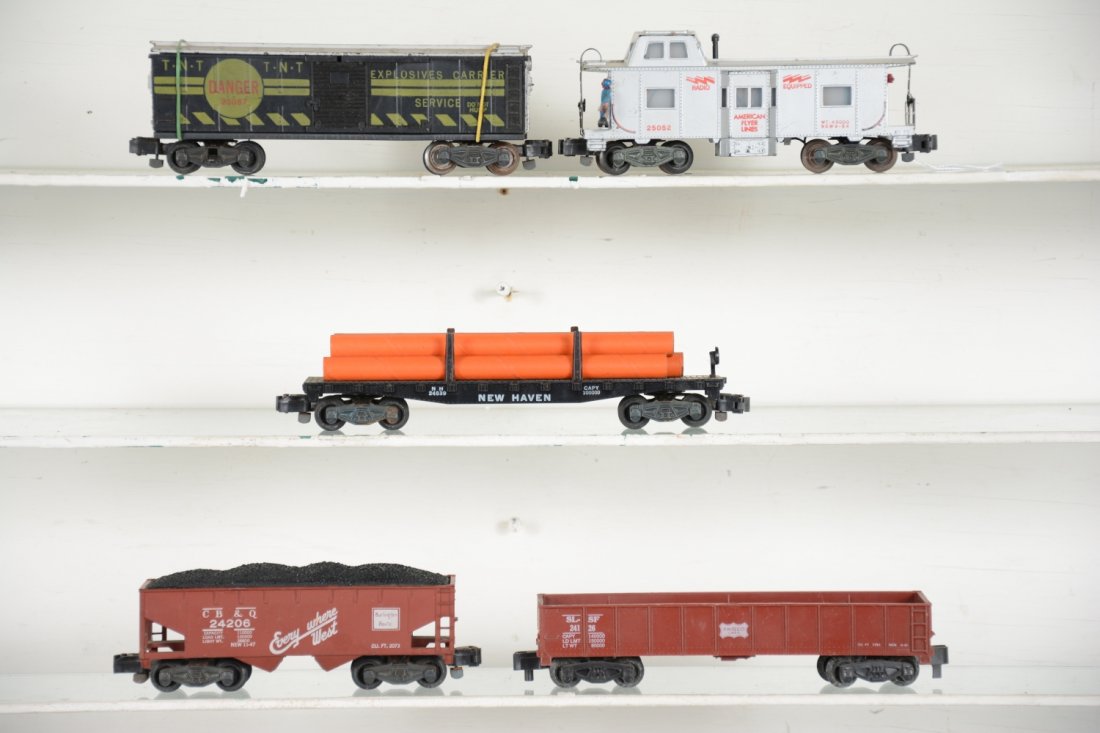 American Flyer 5-Digit Freight Cars: S Gauge. Includes a 24206 CB&Q hopper; 25057 target car, C5+; 24126 PRR gondola; 24539 NH flat with 5 orange cardboard pipes; 25052 bay window action caboose. All show light to moderate playwear, C6+-