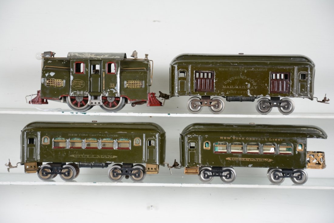 Lionel 33 Passenger Set: ST Gauge. Includes a 33 electric loco, motor is clean, roof 80% flaking, C4; 32 baggage, missing 2 door handles; 35 Pullman; 36 observation. Cars show light playwear are clean & shiny, C6-7