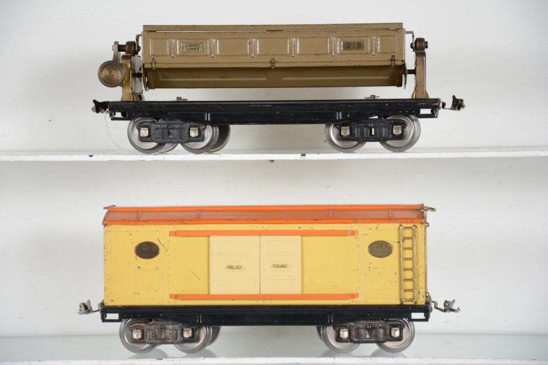 Lionel 214 & 218 Freight Cars: ST Gauge. Includes an early 218 dump car with double handles, replaced tipple gear, Clean C7; 214 boxcar, showing moderate playwear, C6