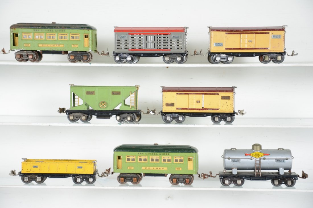 Lionel Rolling Stock Lot: Includes 2 #607 Pullmans, 1 roof has rust spots; 652 gondola; 653 hopper; 654 Sunoco tank car, C7; 656 stock car; 2 #655 boxcars, missing 1 door. Rest show modferate playwear, C5-6