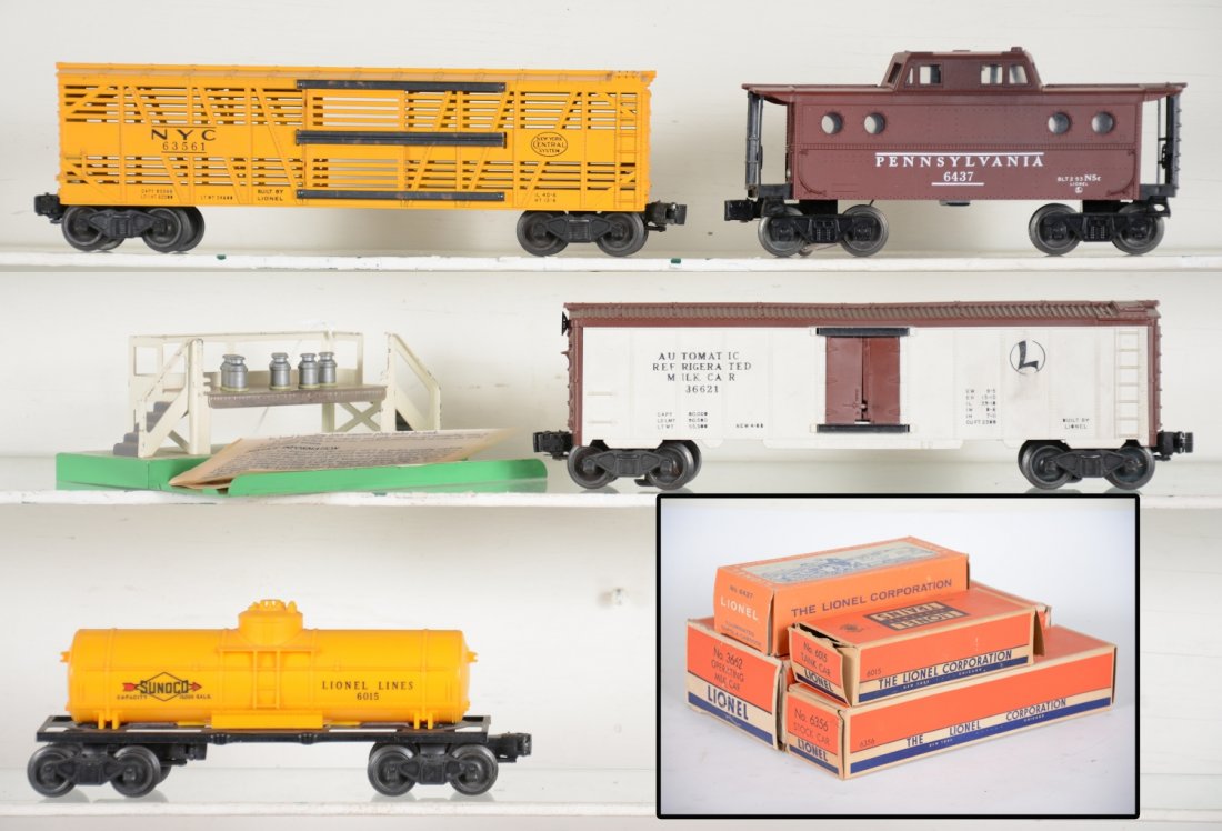 Boxed Clean Lionel Freight Cars: Includes 3662-1 milk car with platform, complete; 6356 NYC stock car; 6437 late PRR N5c caboose; 6415 Sunoco tank car. All are fairly clean with boxes and show light playwear, C7-8