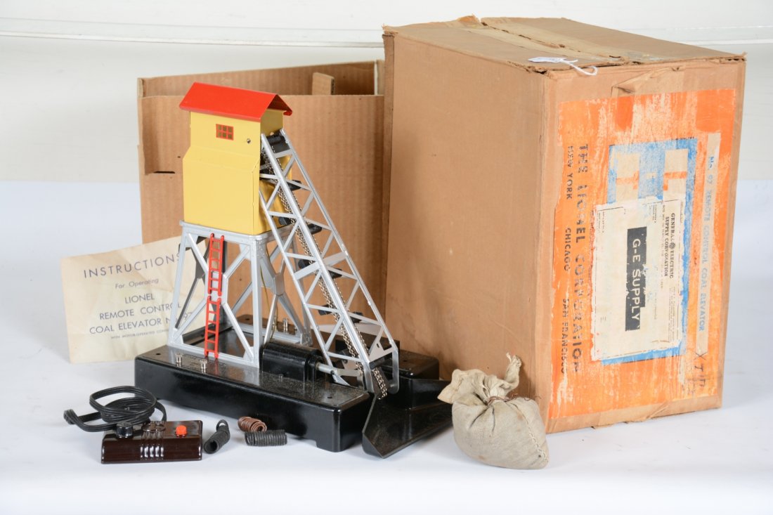 Boxed LN Lionel 97 Coal Elevator: Super example in LN condition with bright silver, controller, instructions, loose coal. Includes a paper label box, used as shipper to GE Supply with all inserts. Otherwise shows very light signs of u