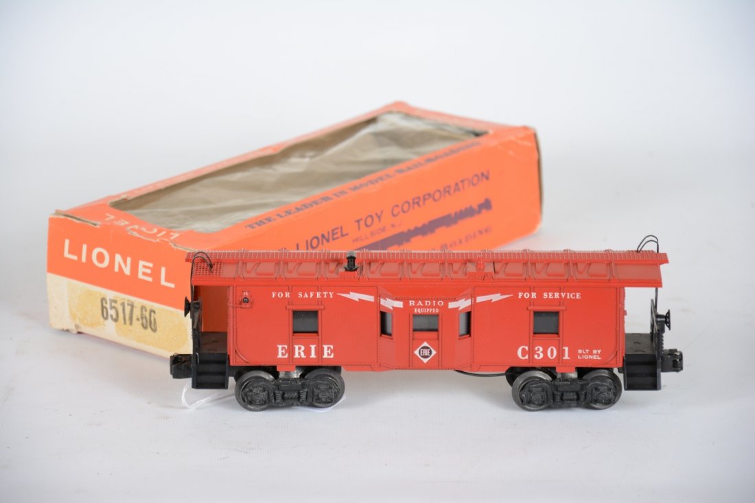 Mint Boxed Lionel 6517-60 Erie Baywindow Caboose: Rare car in as good as it gets condition! Clean satin patina with bright graphics and unrun wheels. It has a nice cellophane window box with insert. It is Mint, C10 WOW!