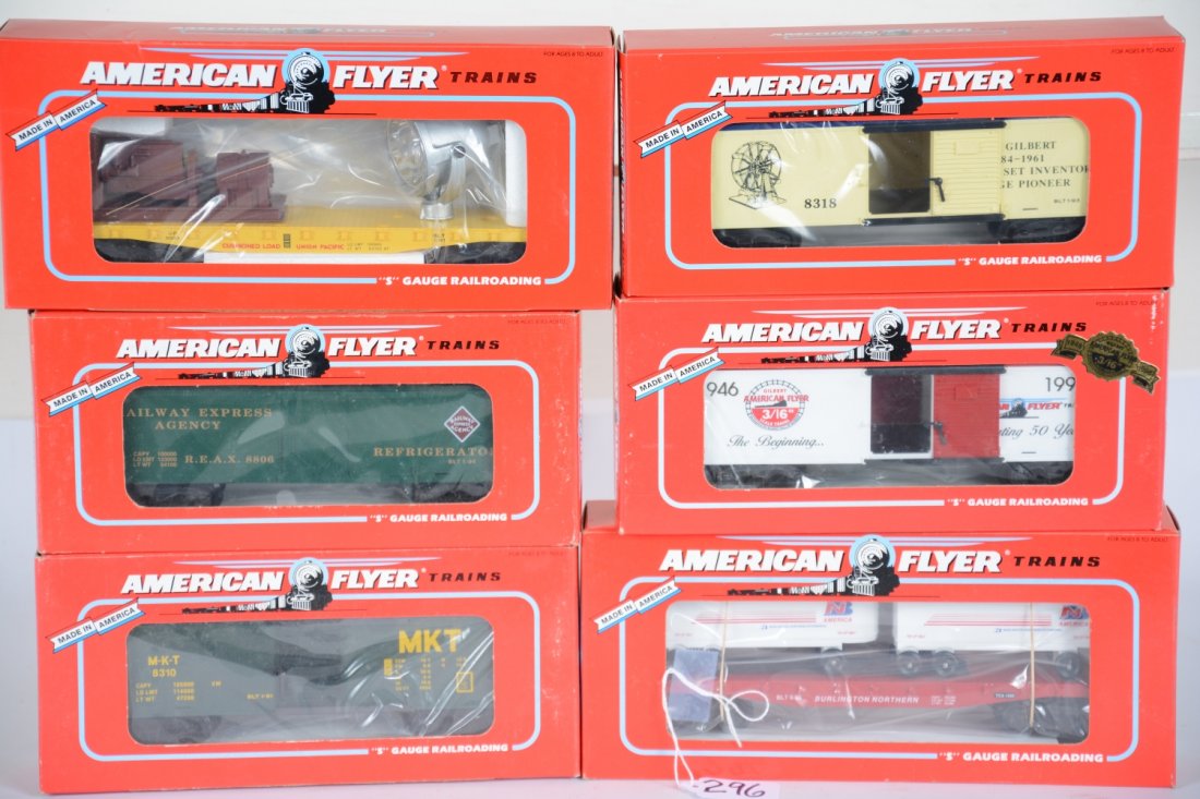 Lionel American Flyer Freight Cars: S Gauge. Includes 48806 REA reefer; 48491 BN flat with vans; 49003 UP searchlight; 48324 50Th Anniv. Boxcar; 48318 Gilbert boxcar. All are new in boxes, C10