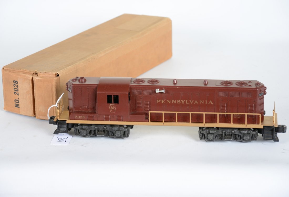 Super Boxed Lionel 2028 PRR GP7 Diesel: One of the nicer examples we have seen. Unusually strong gold stampings with bright, clean gold frame. The cab is intact and has a nice box. It shows light playwear, C8 Nice Example!