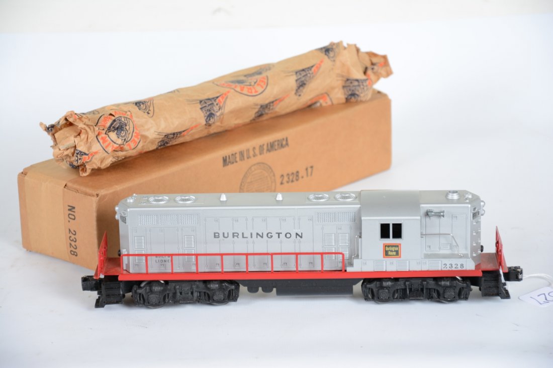 Super Boxed Lionel 2328 Burlington GP9 Diesel: Nice bright silver paint with matte metallic patina & nice even lettering. It has a clean frame & battery box with wrapping. It shows very light runtime with box, C8+ Nice example!
