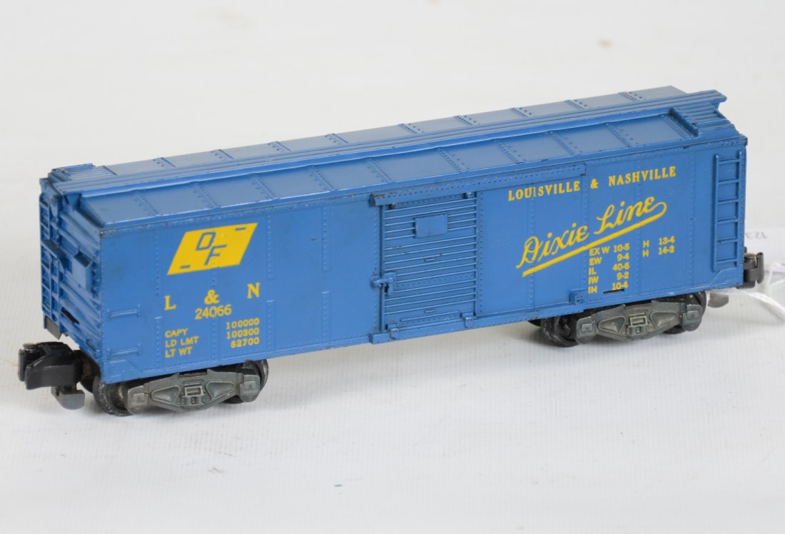 Clean American Flyer 24066 L&N Boxcar: S gauge. Nice example with bright lettering, just missing its brake wheel. It shows light playwear, otherwise C8. Nice.