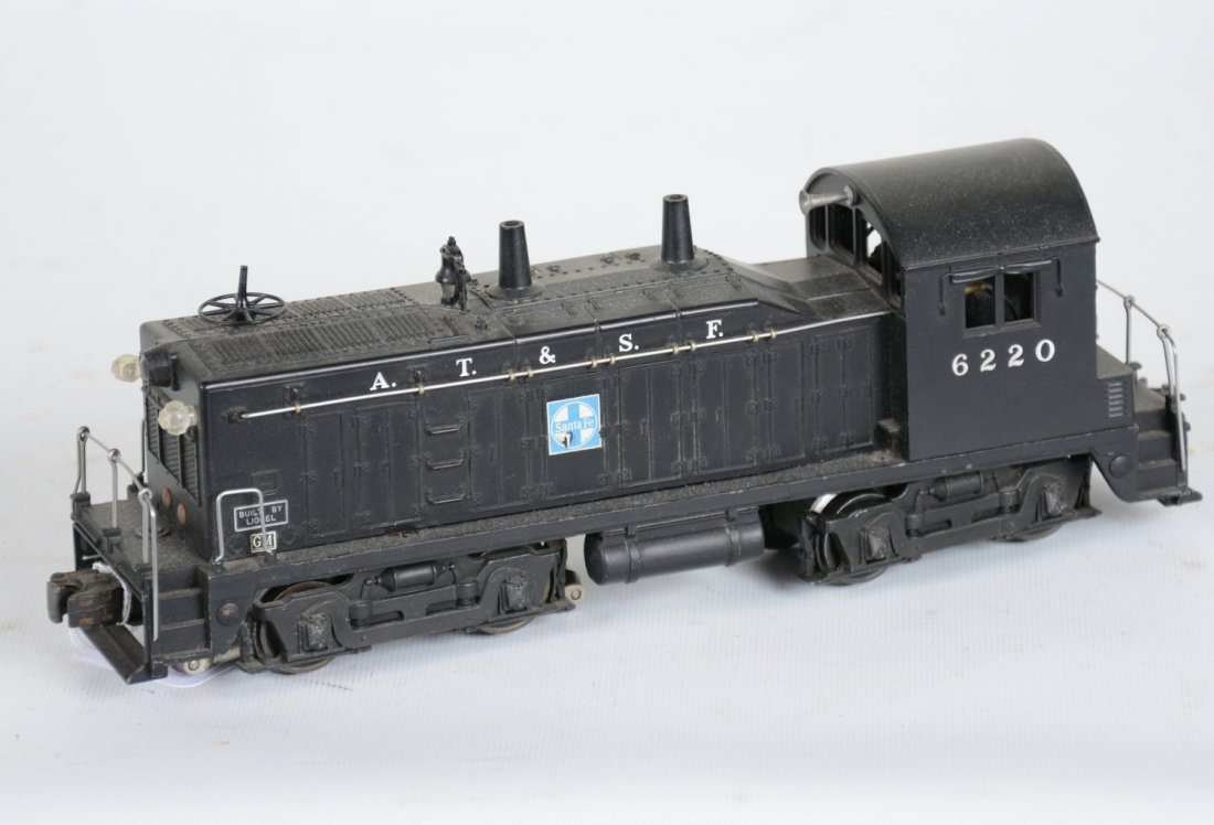 Clean Lionel 6220 SF NW2 Diesel with Bell: Super matte patina with 95% decals; bell mechanism is intact and shows light runtime, C8. Nice example.