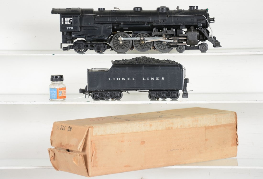 Clean 1950 Lionel 773 Hudson: Nice patina with light shelf dust. Railings are straight with nice cab lettering; 2426W cast whistling tender with some light paint flakes on frame. It shows light runtime with SP pellets and loco box