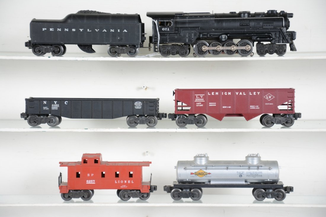 6Pc Lionel 671 Steam Freight Set: Includes a 671 PRR Turbine, 1952 version; 2046W-50 PRR tender; 6462 gondola; 6456 LV hopper; 6465 Sunoco tank car; 6257 caboose. They show light to moderate playwear, C7