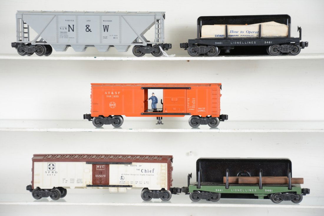 Lionel Freight Cars: Includes a nice 3484-25 GN operating boxcar, C8+; 6446-54 N&W cement car, C8; 6672 SF reefer, black lettering, C7; 3461-25 lumber dump car with bin; 3461 lumber dump car with bin, both C7