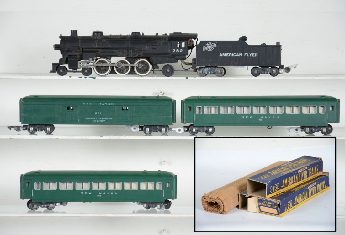 Nice Boxed American Flyer 282 Passenger Set: S Gauge. Includes a 282 C&NW Pacific loco with smoke & Choo-Choo. It has the coal pusher tender; 651 baggage; 2 #650 NH coaches. All show light playwear with wrap & boxers, Dusty, C8 Nice.