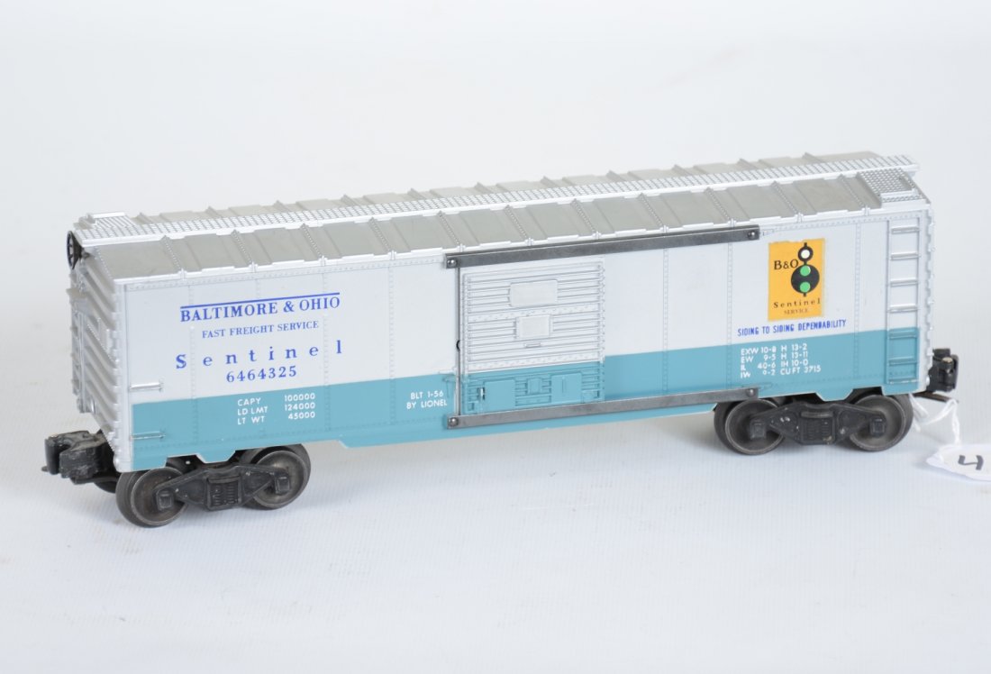 Clean Lionel 6464-325 Sentinel Boxcar: Beautiful and scarce car with nice clean silver. 1 decals has some minor flaking on top edge, other side is 100%. It is on a type IIB body and shows light playwear with factory chipped ladder rung 1 s