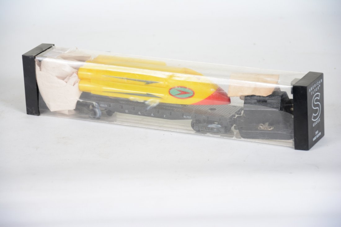American Flyer 25515 Kleer-pak Rocket Sled: S Gauge. Scarce packaging! Car is clean with envelope holding latch, spring and pilot with track trip. Car show light playwear with scarce Kleer-pak box, C8. Nice.