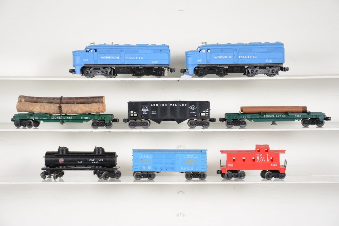 Lionel 205 MP Diesel Freight Set: Includes a 205 MP Alco AA diesels, both cowls have been glued; 6361 timber car, missing 1 chain; 6465 Gulf tank; (6076) hopper; 3362 log dump; 6044 Airex boxcar; 6059 M&StL caboose. All show light to