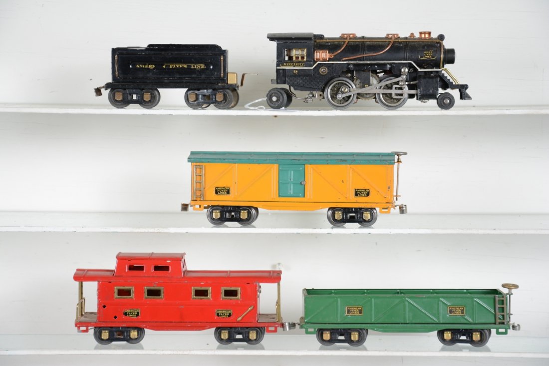 5Pc American Flyer Freight Set: Includes a 3307 steam loco; 3189 tender, decals 50%; 3208 boxcar; 3207 sand car; 3211 caboose, all with curly Q couplers. They are clean and show moderate playwear, C6