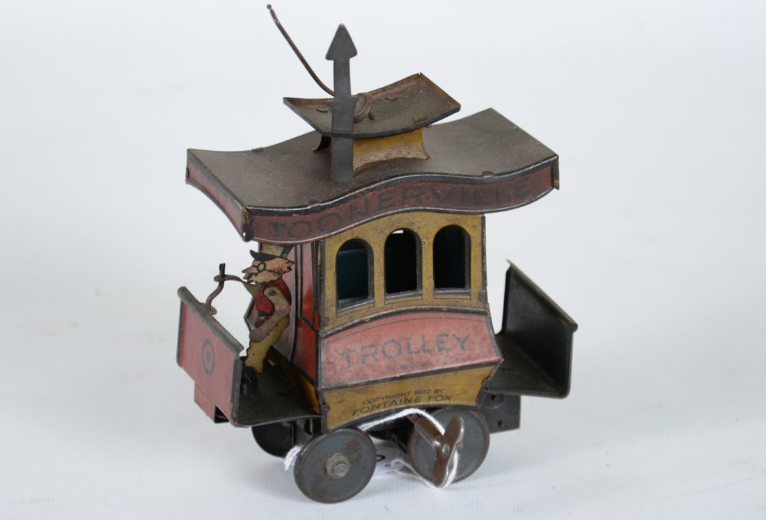 Nifty Toonerville Trolley: Dated 1922. litho tin floor toy with functional mechanism. The litho is a bit dark and could use a cleaning. It shows moderate wear, C6