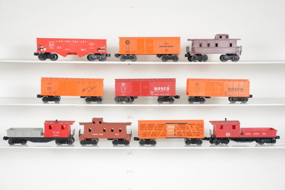 Lionel Freight Cars: Includes 6024 Shredded Wheat boxcar; unusual 6014 orange Frisco boxcar; 6476 hopper; 6130 SF work caboose, last version; 6646 stock car; 2 #6014 Bosco boxcars; 2 #6017 cabooses, 1 painted on orange mo
