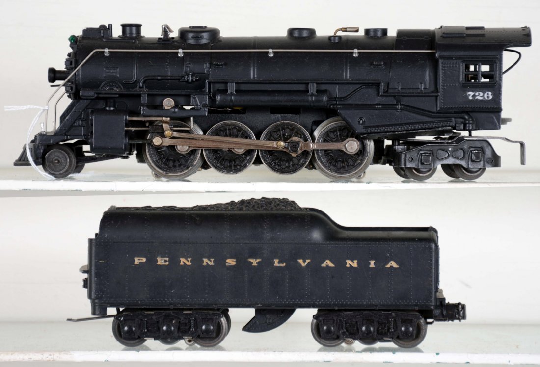 Restored Lionel 726 Berkshire Locomotive: Includes an early 1946 smoke bulb 726 that has been restored around the cab numbers and includes an original 2671W PRR tender with some gold paint over lettering. Otherwise shows light to moderate pla
