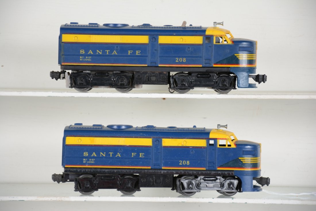 Lionel 208 SF Alco AA Diesels: Clean diesel set with operating horn(battery still inside). Power shell is cracked and has repaired cowl, dummy shell is intact. Both have good decals with some age cracking only. Make great runners, 