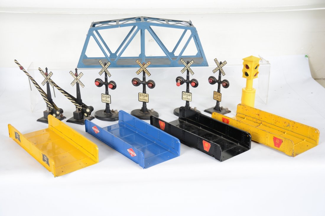 Marx Accessory Lot: Includes a blue RI trestle bridge; 4 different clean girder bridges; 2 electric crossing gates; 4 flashers; traffic signal. All show light to moderate playwear, C6+-7