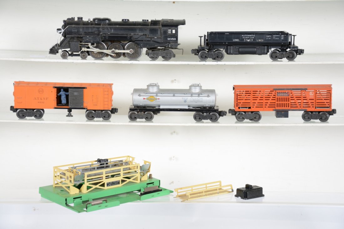 Lionel Lot: Includes a 2056 steam loco, only; 3469 coal dump; 6465 tank car; 3464 SF operating boxcar; 3656 cattle car with pen. Armor decal with 1 cow, ramp & 364c. All show moderate playwear, C5+-6