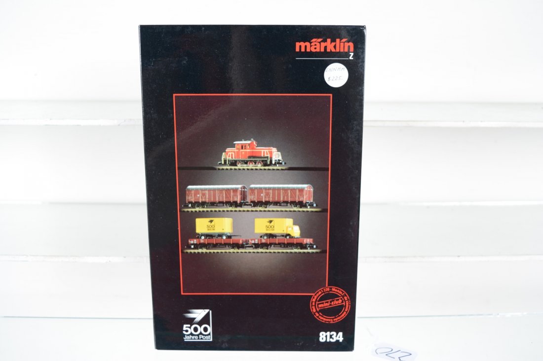 Marklin Z Gauge 8134 500 Jahre Post Set: Nice set with an 0-6-0 diesel; 2 goods wagons and 2 flats with truck & pup trailer. It is new in set box, C10