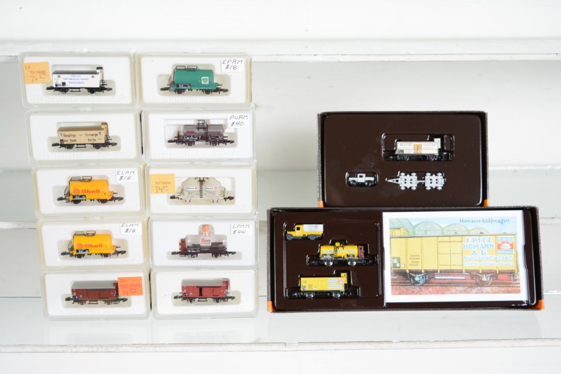 Marklin Z Gauge Freight Cars: Includes 82507 3-pc Fritz Homan set; 86615 3-pc Ganter beer set; 88662 beer car; 8661 beer car; 2 #8611 Shell tanks; 82450 Asback glass wine car; 2 #8639 goods wagons; 86732 chemical tank; 8614 BP tan