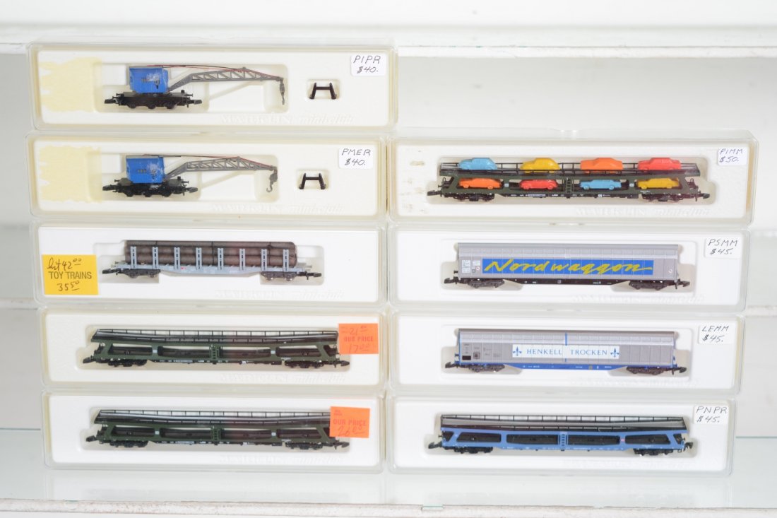 Marklin Z Gauge Freight Cars: Includes 8621 cranes; 2 #8715 auto-loaders; 86551 log flat; 8709 auto-loader; 8714 auto-loader; 82412 & 13 slide door boxcars. All are new in boxes, C10