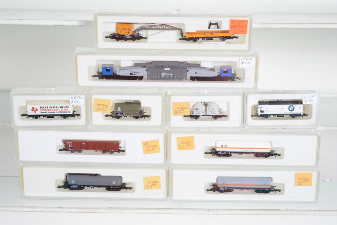 Marklin Z Gauge Freight Cars: Includes 8620 transformer carrier; 8657 crane/flat set; 8667 & 8607 tank cars; 8668 hopper; 8666 chemical car; BMW reefer; 8659 tank car; Texas Instruments container flat; 6880 tank car. All appear ne
