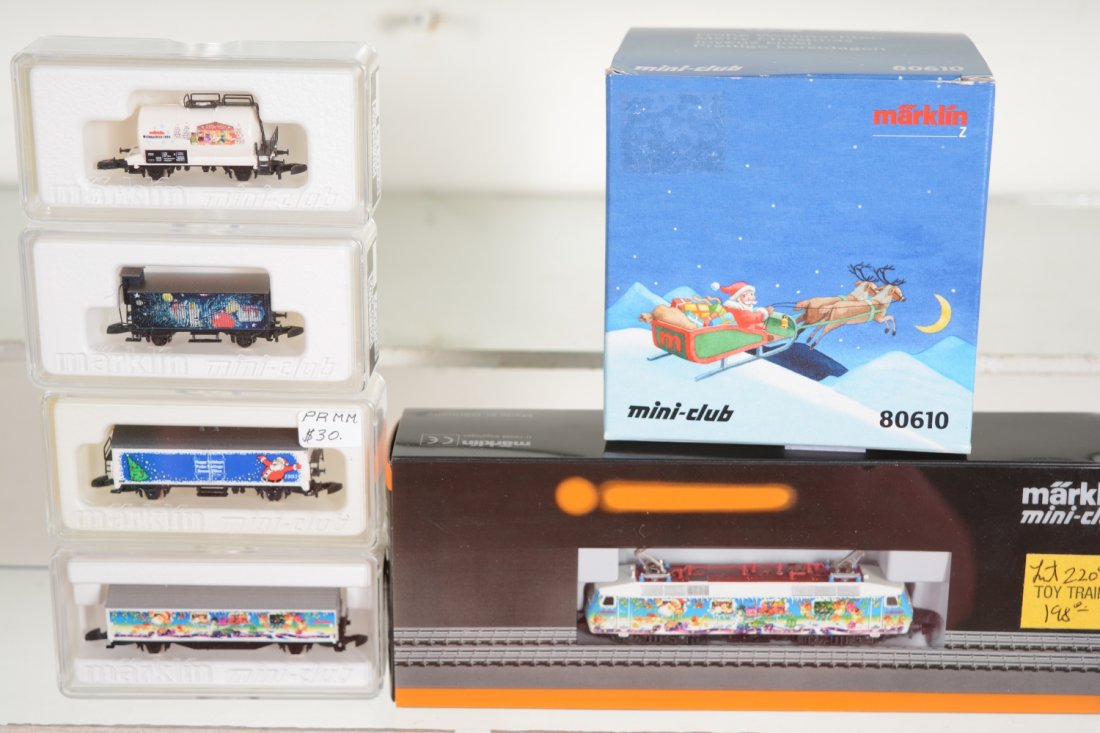 Marklin Z Gauge Christmas Trains: Includes an 88531 DB BO-BO electric; 98013 tank car; 80607 reefer; 2121A reefer; 98007 goods wagon; 80610 reefer in ornament case. All appear new in boxes, C10