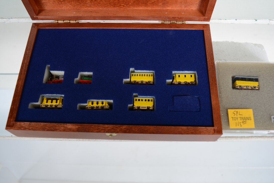 Scarce Railex Brass Adler Set, Plus: Z Gauge. Includes a 7-pc train set of this Iconic early train set modeled and painted brass. It includes a sound module car. 1 coach has loose wheels. It comes with its wood display box and sleeve; pl