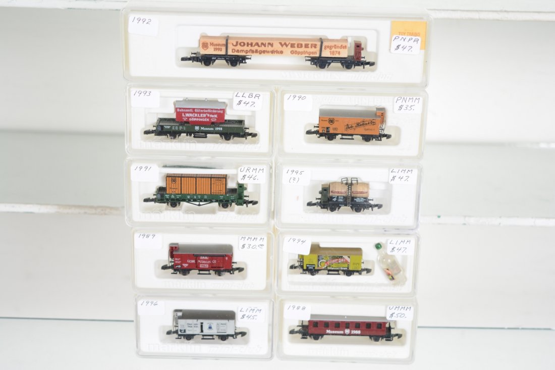 Marklin Z Gauge Museum Cars: Includes 1992 lumber; 80006 wine barrel; 1990 reefer; 1994 reefer with bottle; 1991 container flat; 1996 reefer; 1988 coach; 1989 reefer; 1993 flat with wagon. All are new in boxes, C10