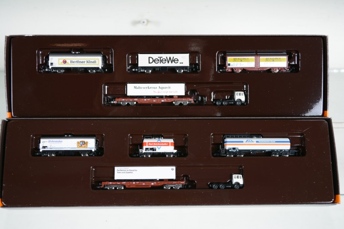 Marklin Z Gauge 8696 & 9694 Car Assortments: Each is a 5-pc set with includes a flat with trailer, tractor and 3 additional Freight cars. They are new in set boxes, C10