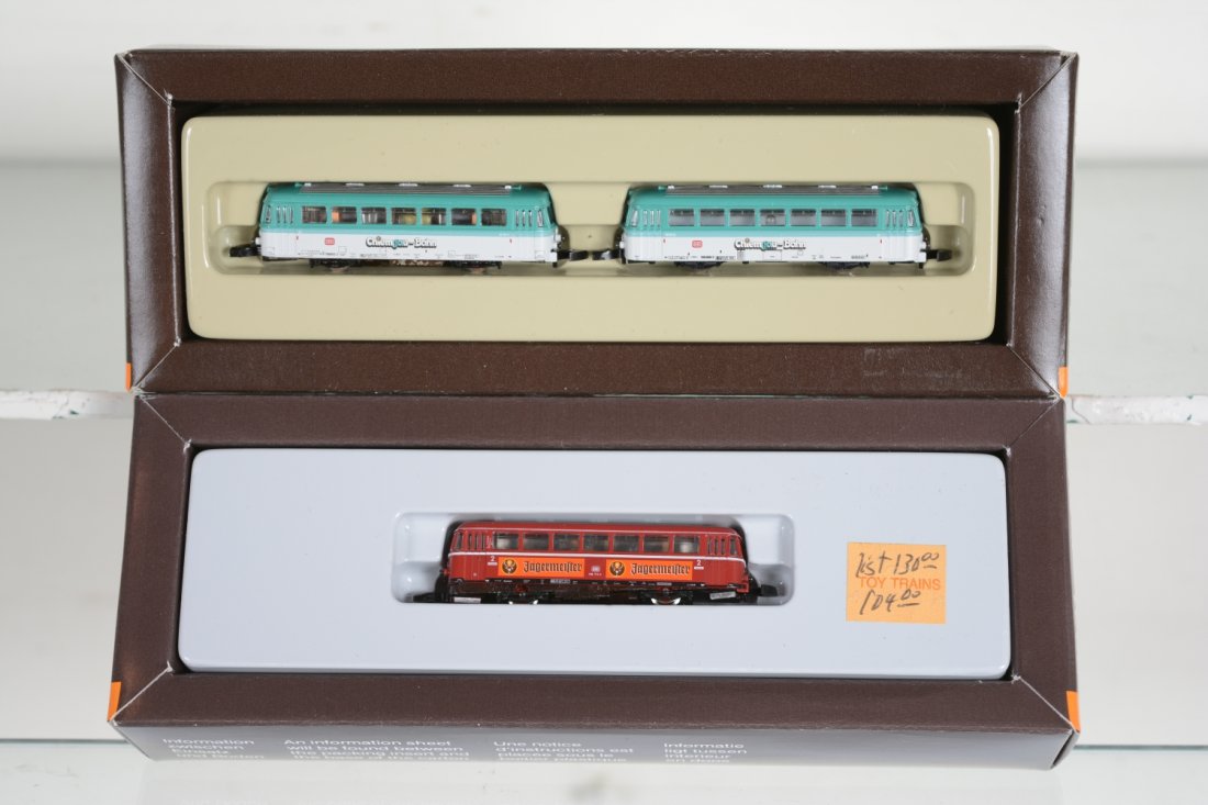 Marklin Z Gauge Rail Cars: Includes an 8112 Chiemgau-Bahn with trail car; 8831 Jagermeilter power car. Both are new in boxes, C10