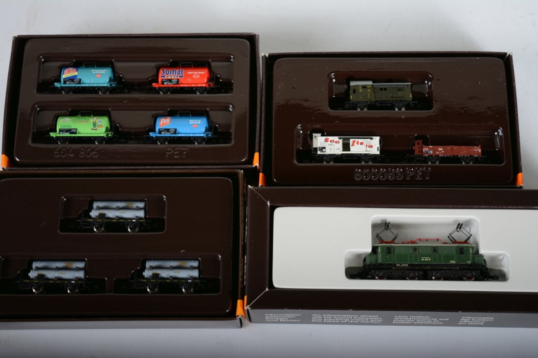 Marklin Z Gauge DB Freight Set: Includes an 8811 BO-BO electric loco; 86112 4-car tank cars set; 82400 3-car gas cylinder car set; 823213-car set. All appear to be new in boxes, C10