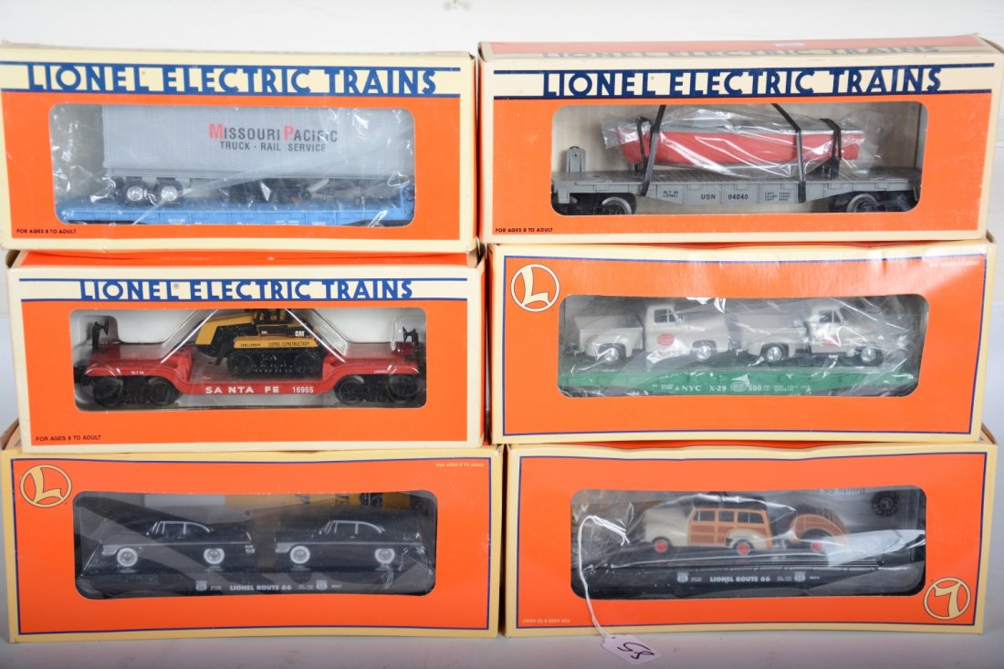 Lionel Freight Cars: Includes 17549 flat with Woody & trailer; 17551 flat with pick-ups; 16955 flat with Challenger; 17557 flat with BMWs; 16910 trailer flat; 16939 flat with Navy boat. All appear like new with boxes, C10